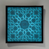 Black and cyan glass flower mandala platter.