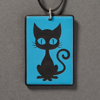 Sandcarved deep sky blue and black glass kitty pendant.