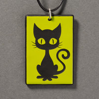 Sandcarved lime green and black glass kitty pendant.