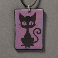 Sandcarved purple and black glass kitty pendant.