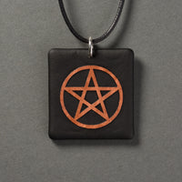 Sandcarved copper and black glass pentacle pendant.