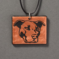 Sandcarved copper and black glass pit bull pendant.